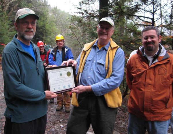 Dave Webber gets Hoeferlin Award from Larry Wheelock. Park Superintendent Eric Humphries is at right.  Photo by Georgette Weir.