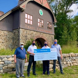 Liberty Subaru presents the Trail Conference with a check from the 2019 Subaru Share the Love Event.