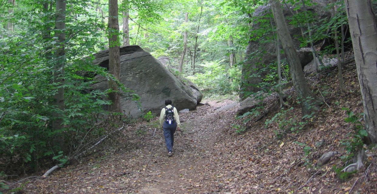 Hiker headed toward split rock Photo: Jane Daniels