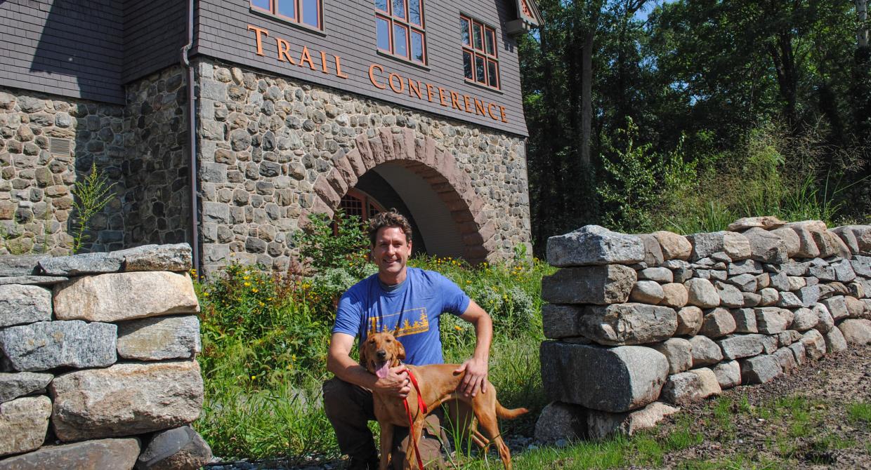 Dia the Conservation Detection Dog and her handler Joshua Beese. Photo by Heather Darley.