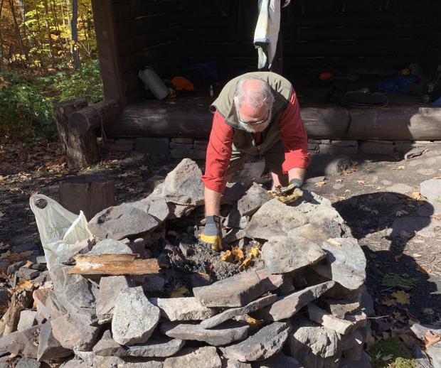 Catskill Lean-To Chair Snapper Petta maintaining a lean-to firepit. Photo by Rob Lambeth.