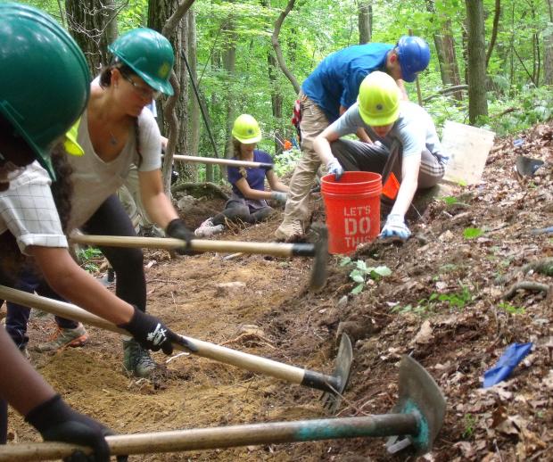 Volunteers work with the Trail Conference Conservation Corps' Palisades Trail Crew on the Red Back Trail in Sterling Forest State Park. Photo by Robert Fernandez.