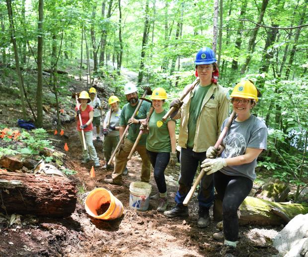 Volunteer and Corps members building trail in Ramapo Reservation on National Trails Day. Photo Credit: Popular Mechanics