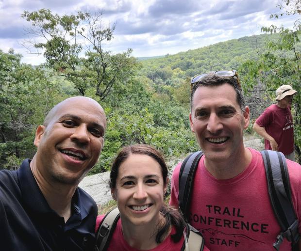 Senator Cory Booker poses with the Trail Conference's Mary Perro and Joshua Howard during a hike at Pyramid Mountain. Photo credit: New York-New Jersey Trail Conference