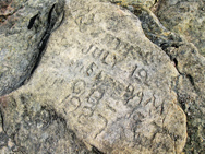 Carvings in the rock ledge just beyond the summit of Slide Mountain. Photo by Daniel Chazin.