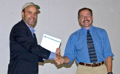 Ed Goodell accepts Adopt a Resource agreement from DEC's Bill Rudge.