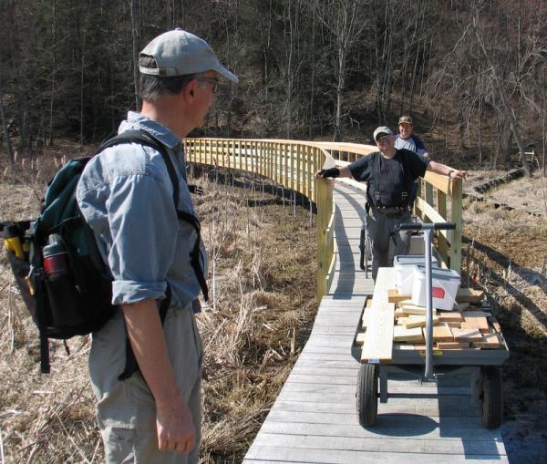 Steve Klauck, center in black, gave more than 350 hours to the A.T. boardwalk project in Pawling.
