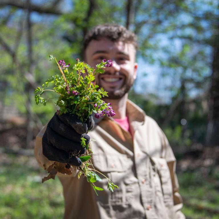ISF Ryan holding gloved hand and plants
