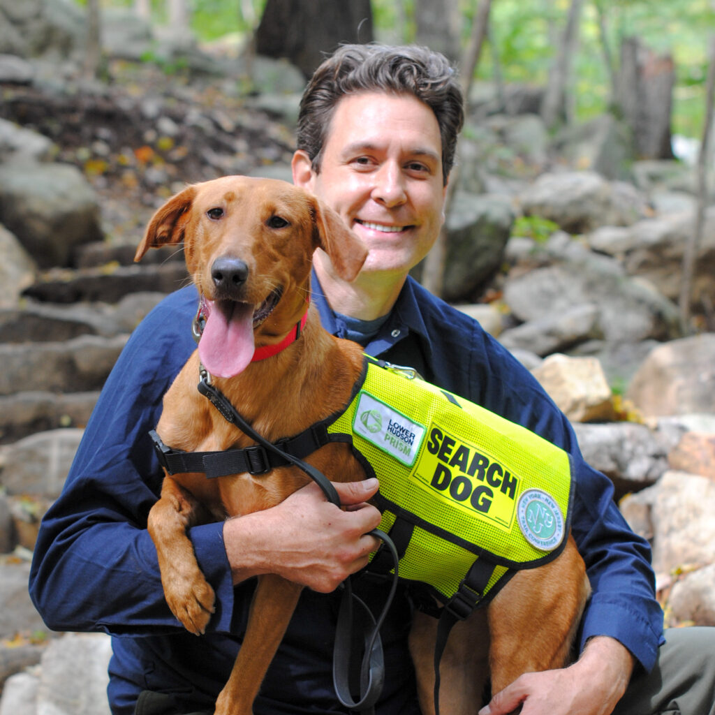 Joshua Beese and Dia the Conservation Detection Dog. Photo by Heather Darley