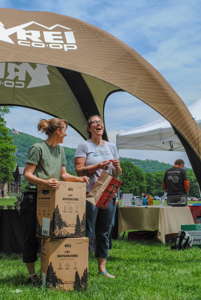 Our partners from REI raffle off gear prizes at the National Trails Day celebration at Bear Mountain State Park. Photo by Heather Darley. Our partners from REI raffle off gear prizes at the National Trails Day celebration at Bear Mountain State Park. Photo by Heather Darley.