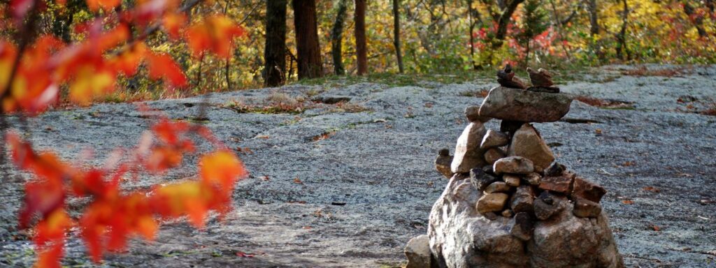 This image has an empty alt attribute; its file name is RobertCelestin_PrecariousStones_3-1024x384.jpg